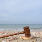 Judge hammer on the beach