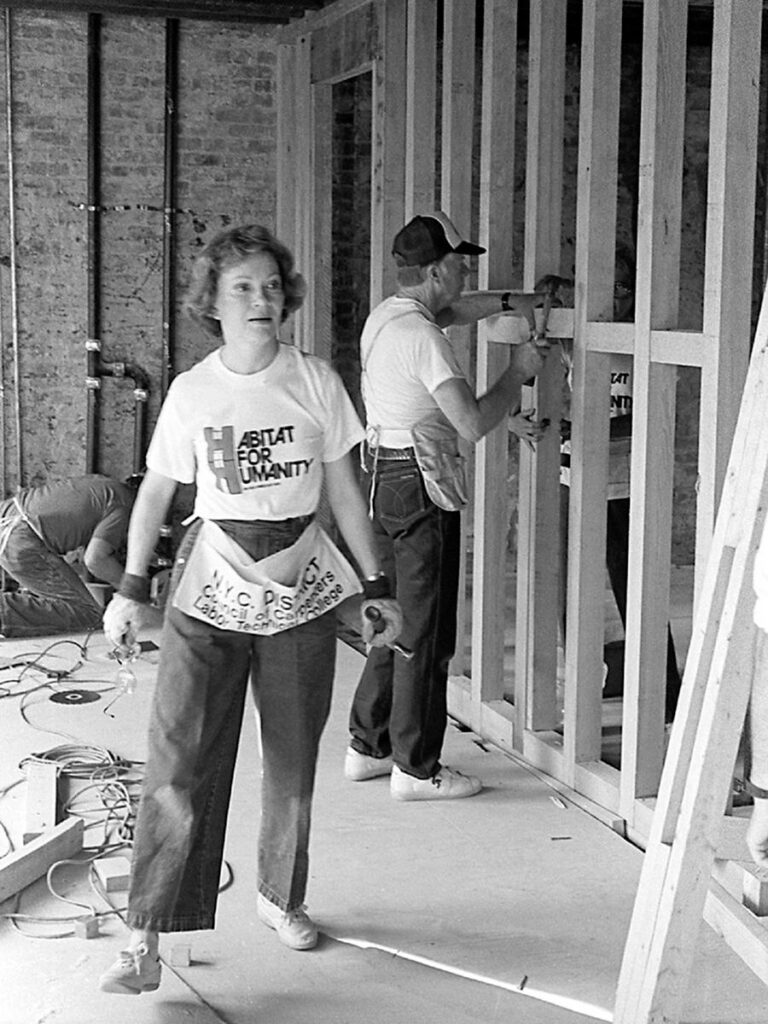 Former president Jimmy Carter and First Lady Rosalynn Carter working at an early Habitat for Humanity Project